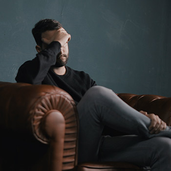 sad man on couch